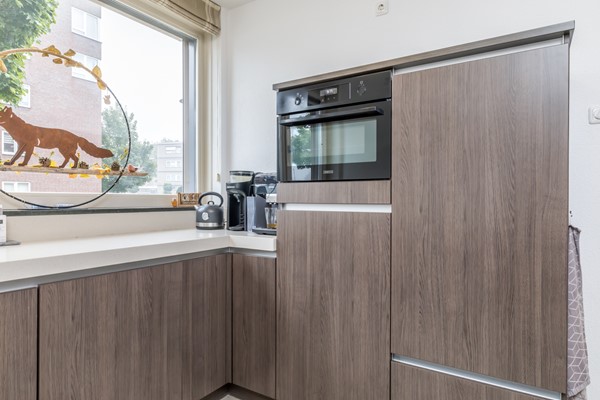 Foto - Te koop: In Landgraaf op een zeer kindvriendelijke locatie bevindt zich deze nette en moderne instapklare energiezuinige tussenwoning uit 2008